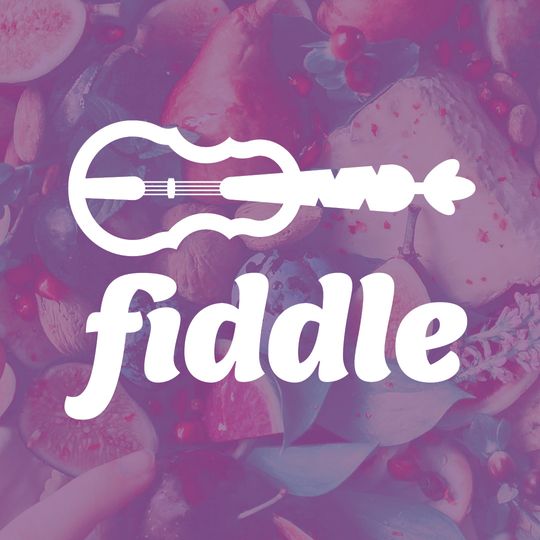 Fiddle logo placed on a hipster bowl of fruit with a hand reaching in for a dark red cherry