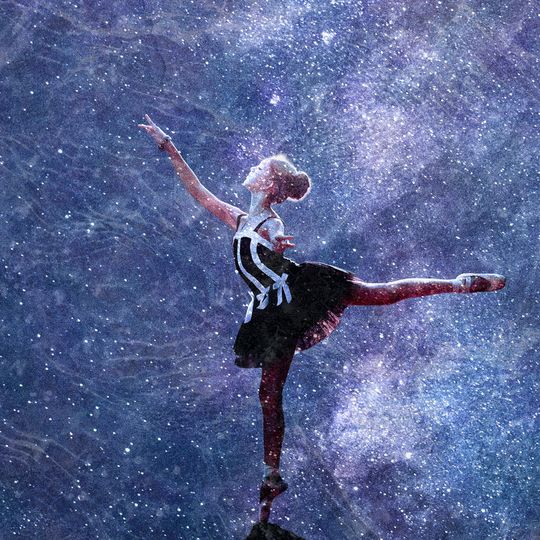 A ballet dancer reaching the stars